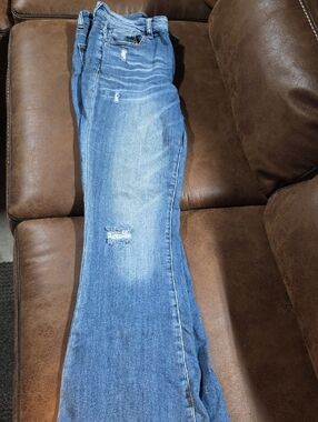High-Rise Light Blue Flare Jeans with Subtle Distressing
